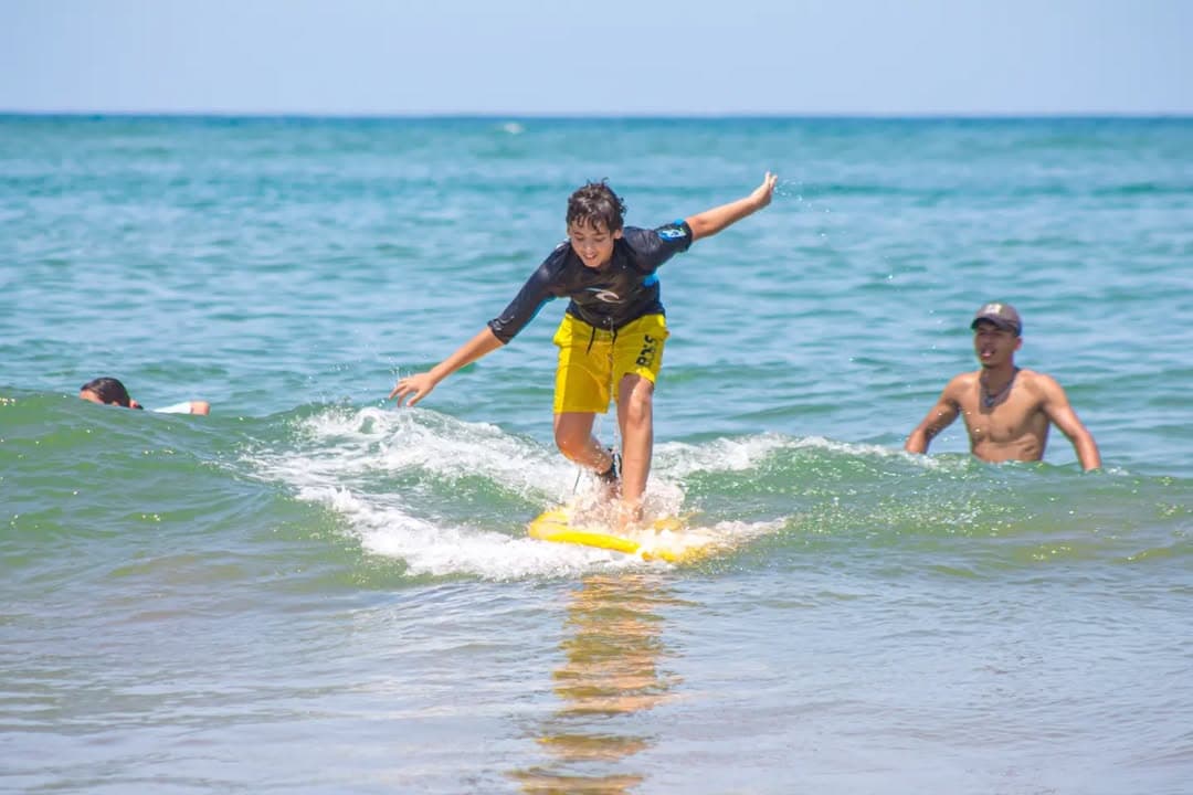 Surfer riding wave with style