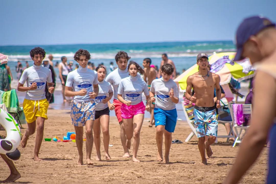 Surf group with their boards on the beach